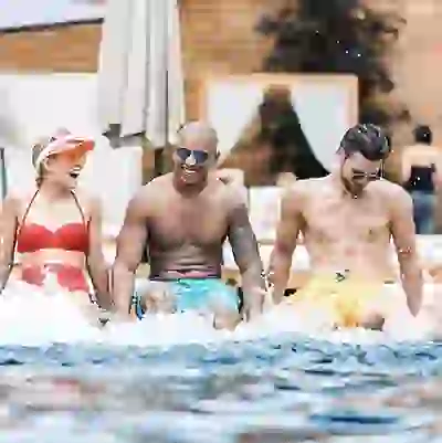 Residents laughing in the rooftop pool in Greenville